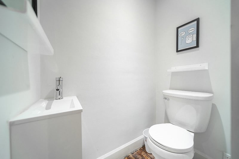 Newly added half bathroom located next to the office.