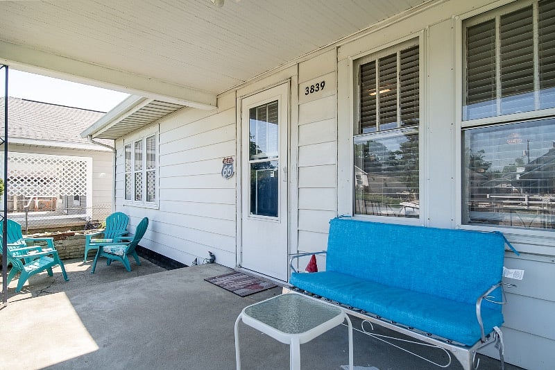 The front porch has nice seating for morning coffee.