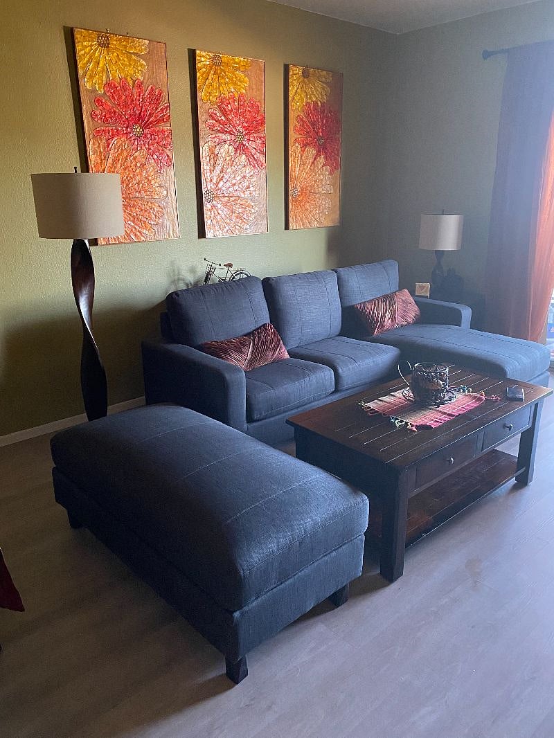 New sectional and hardwood floor in living room.
