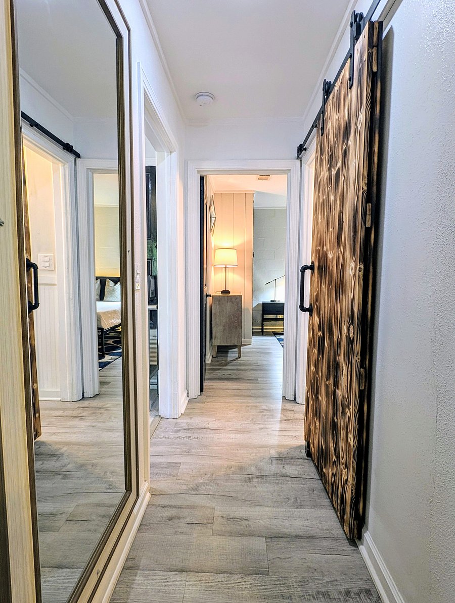 Hallway, approaching bedroom; Shared bathroom on right