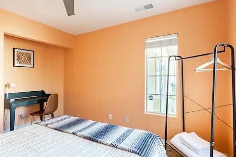 Queen bed with in room workspace

