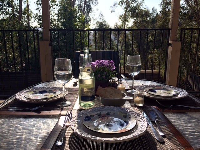Large upper back deck off kitchen and dining area with seating and gas grill