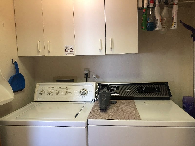 Laundry area. Space for tenant's items in cupboard.