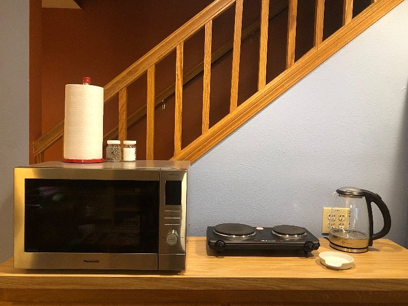 Combo convection/microwave oven and air-fryer, two-burner cooktop and electric water kettle.