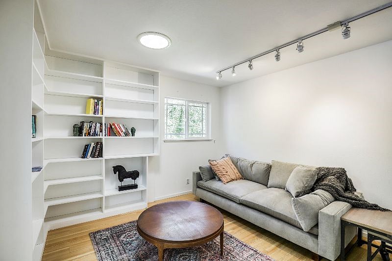 Third Bedroom with couch bed leading to back patio and pool