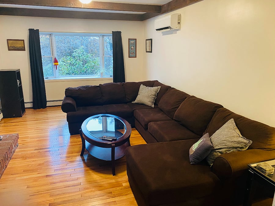 Large and inviting living room, comfortable sectional sofa and large tv with many streaming services included.