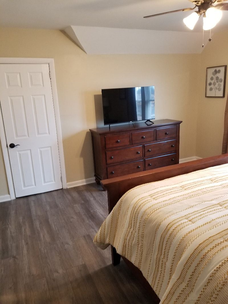 Bedroom #2, queen side, dresser, 2 side tables, closet, ceiling fan, blackout curtains.