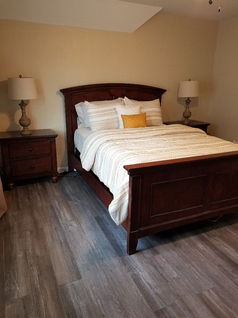 Bedroom #2, queen side, dresser, 2 side tables, closet, ceiling fan, blackout curtains.