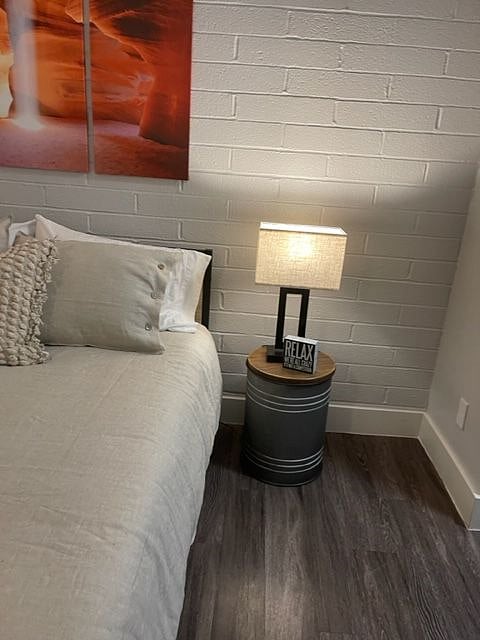 tin with wood lid, also has storage, just lift lid. This will be placed against recliner once the bedside tables arrive.