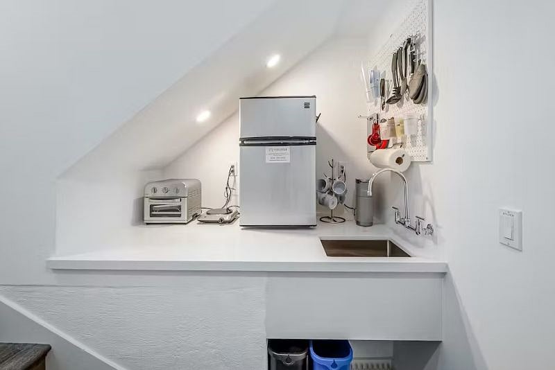 Kitchenette includes: sink, mini fridge, coffee maker, microwave (not pictured), hot plate, toaster oven/ air fryer and cooking supplies. Additional kitchenware, first aid kit and fire extinguisher are located in the pantry/closet.