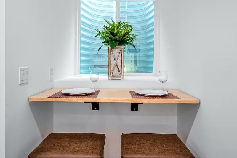 This is a window well that provides natural light from above. You can use this space to eat your meals and/or as a workspace