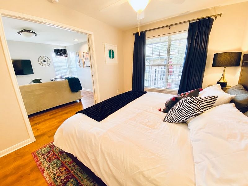 Bedroom with view into living room