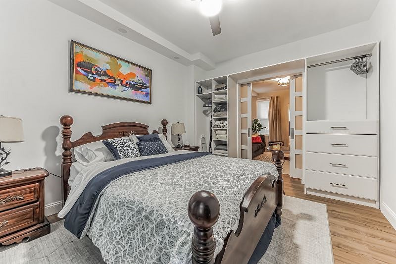 Bedroom with 2 large windows and full length mirror(not shown)