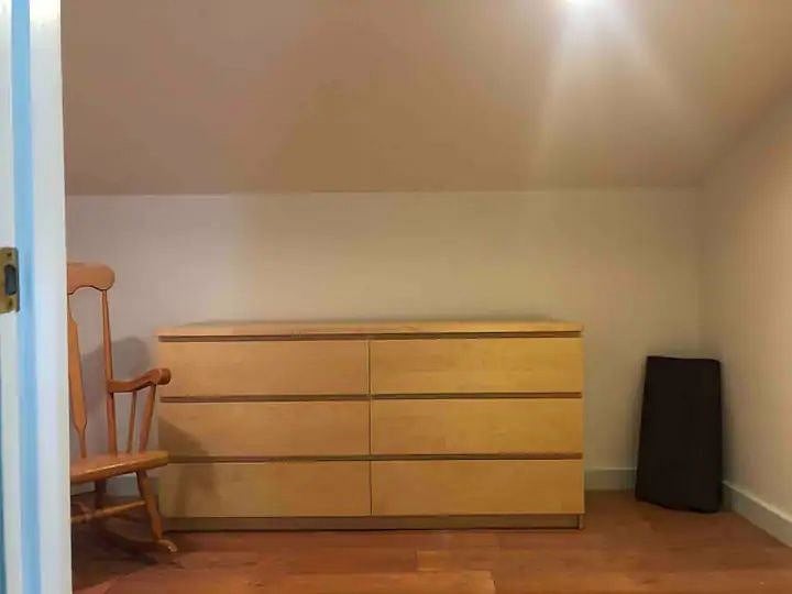 Walk in 8x11 foot closet with dresser, table & mirror.