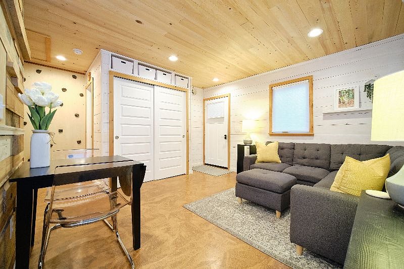 View from the front of the kitchen looking back at dining and living area.