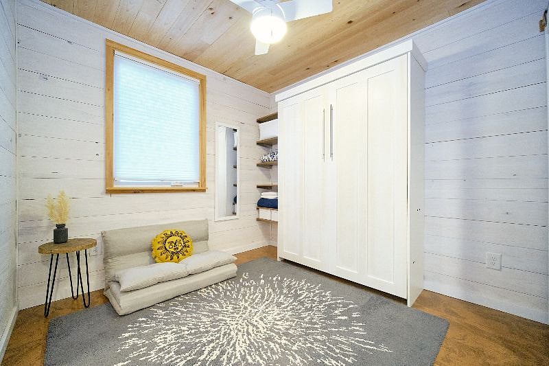 Second bedroom with wall bed folded up. Couch can be stowed under the wall bed when bed is in use.