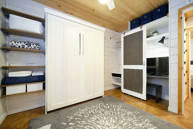 Roku TV and desk space in second bedroom. Barn door slides to reveal closet space.