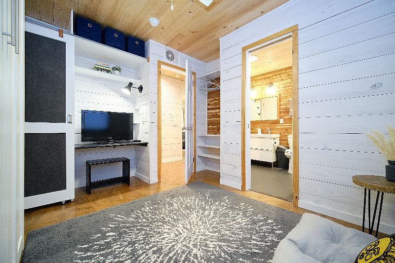 Storage space behind door in second bedroom. Connects to bathroom with a pocket door.
