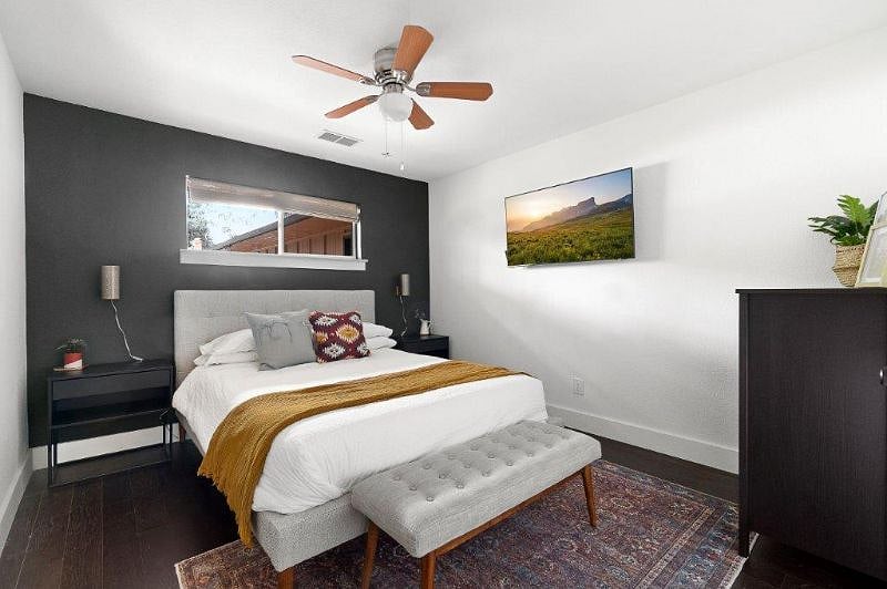 2nd Bedroom includes queen bed, closet, and drawers, and tv.