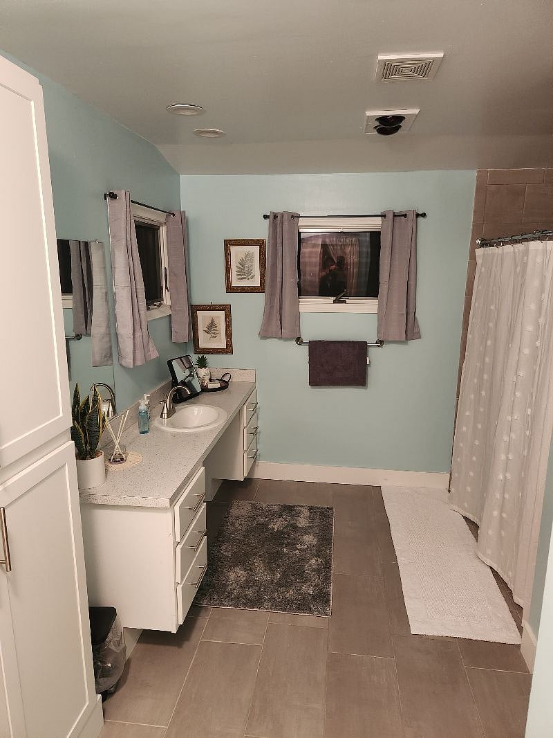 Full bath walkin shower. A laundry hamper has been added not pictured.