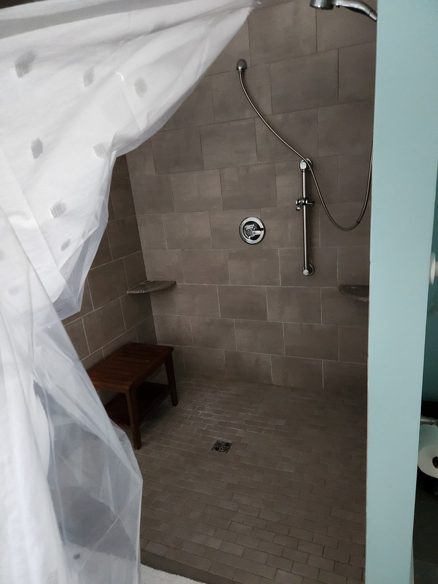 Shower with stool.