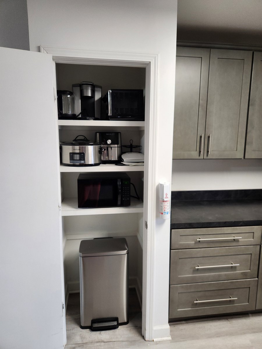 Kitchen Appliance closet. Microwave is plugged in in place...all other appliances need moved to counter top. All appliances pictured remain in unit.