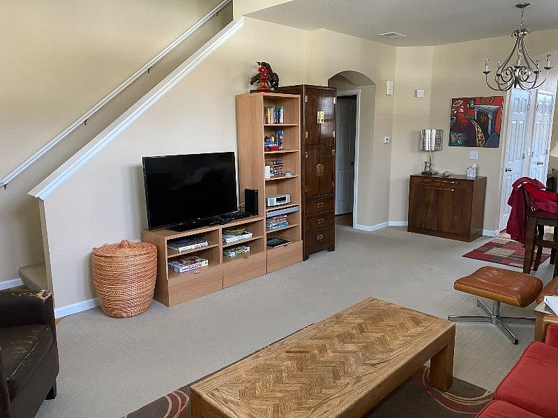 Another view to the living room, smart tv and stairs to upper bedrooms (2)