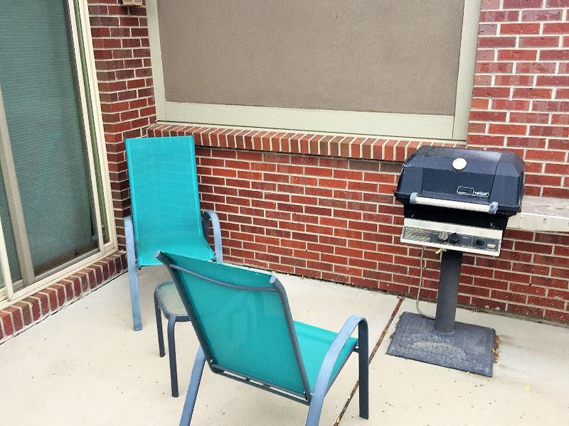 Small patio off the kitchen, complete with a grill for bbqs.