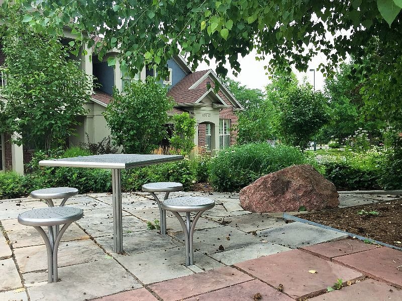 A semi-private picnic area just in front of the townhome.  See our home in the background.