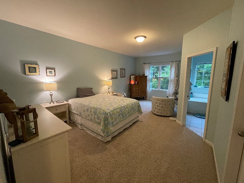 Large primary bedroom suite with blackout blinds.