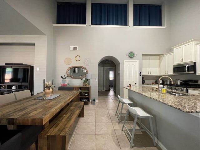 View of upstairs open concept with curtains for privacy.