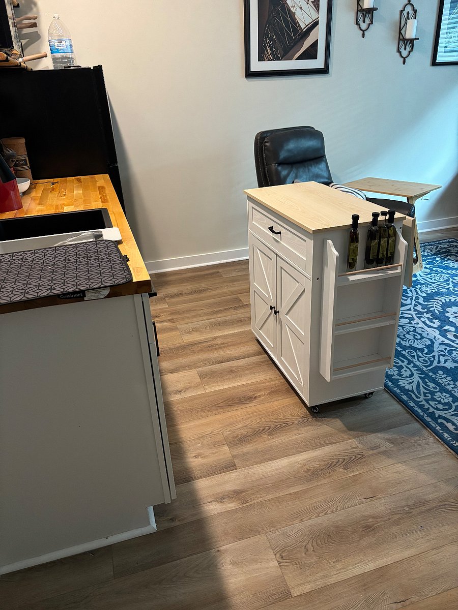 Rolling island adds ample counter space for food prep and cooking