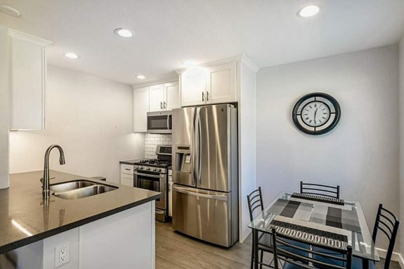 Another kitchen and dining area view.