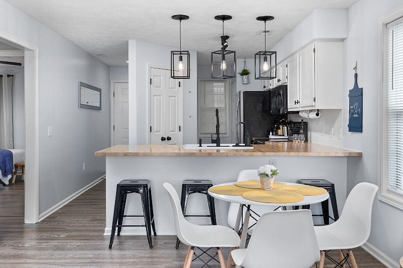 Gather at our dining room table or island to enjoy a delicious meal or utilize it as a workspace