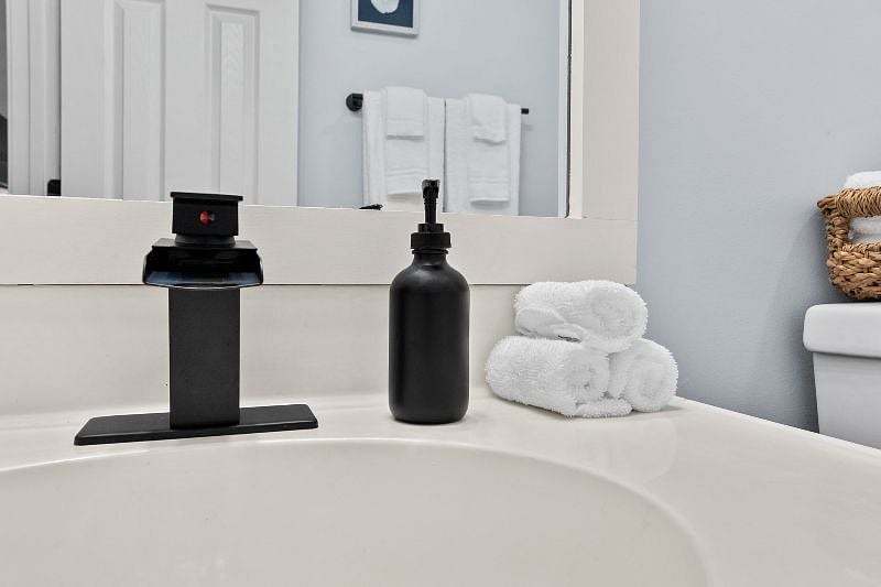 Spacious guest bathroom with a bathtub and shower