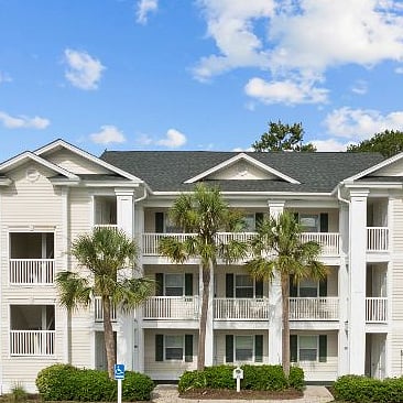 Front of our home. The unit is located on the left side of the building.