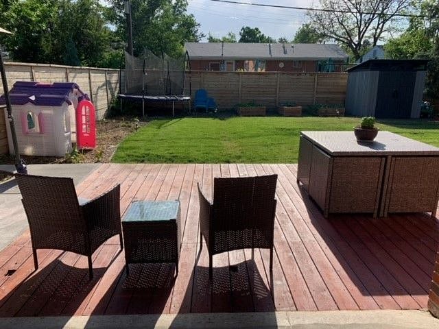 Denver is currently experiencing a drought and water restrictions. Therefore, the yard is yellow and dry but we hope it back to lush and green grass soon!