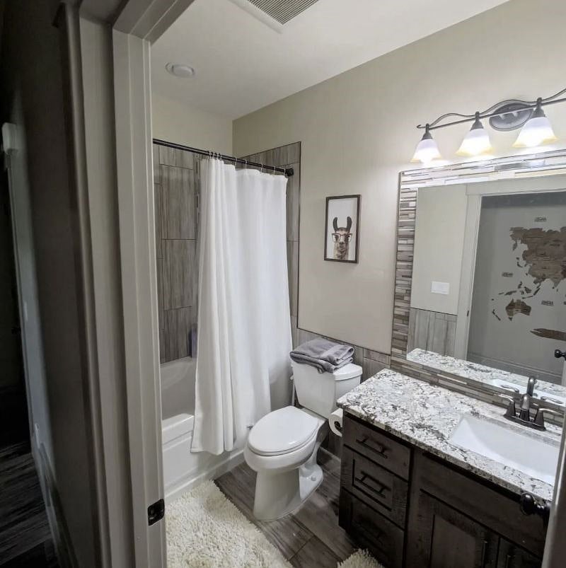 Private bathroom with shower and tub.