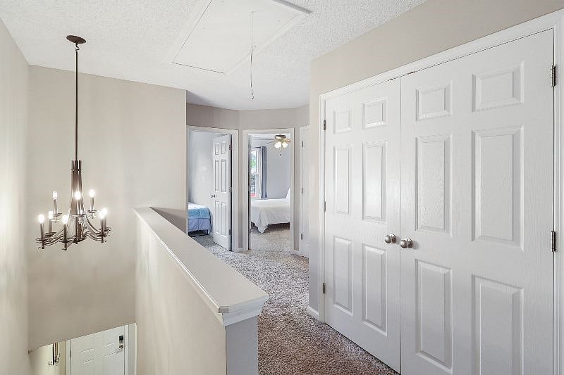Upstairs Landing. Laundry closet behind double doors