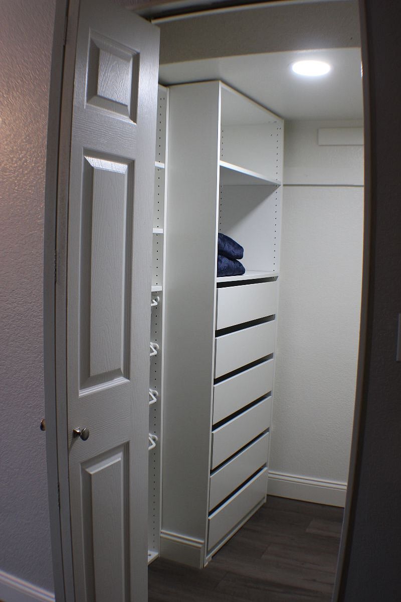 Walk-in closet with built in drawers and slide in and out baskets