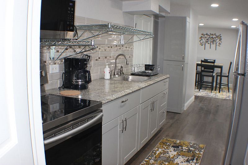Kitchen showing coffee maker and dish drainer