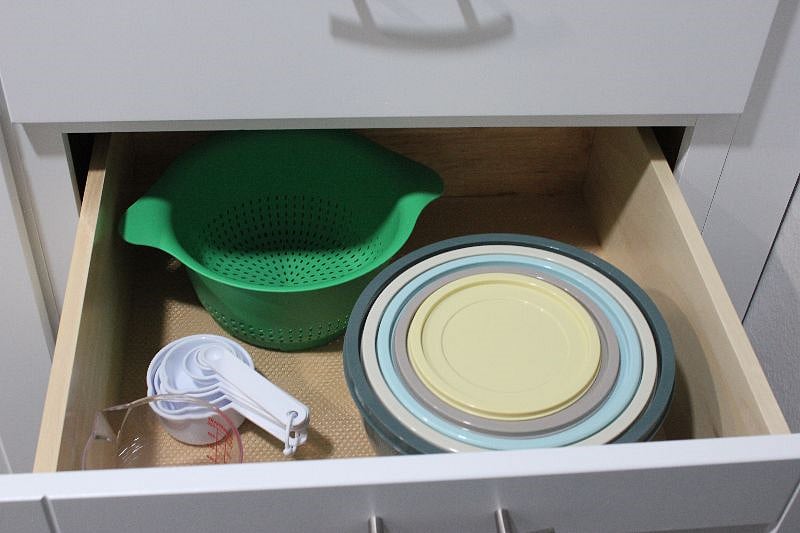 Mixing bowls, strainer and measuring cup, not pictured, grater and multiple drawers