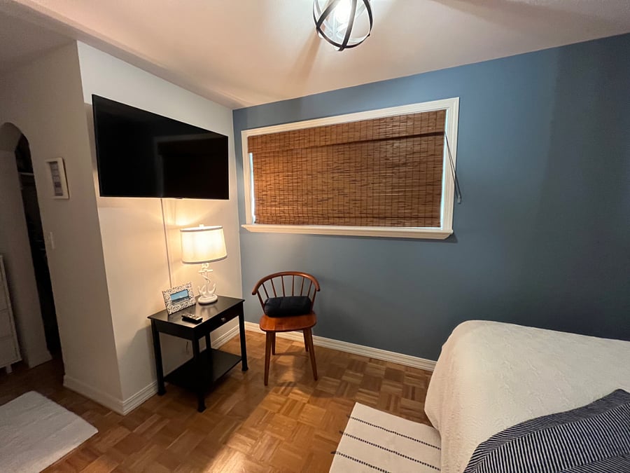 Samsung smart tv and blackout shades in the bedroom