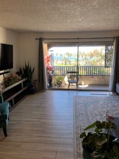 Living room looking from dining area to water