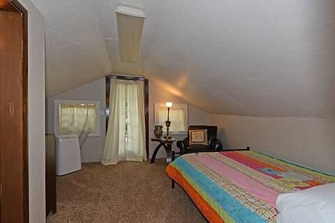 One upstairs bedroom with balcony