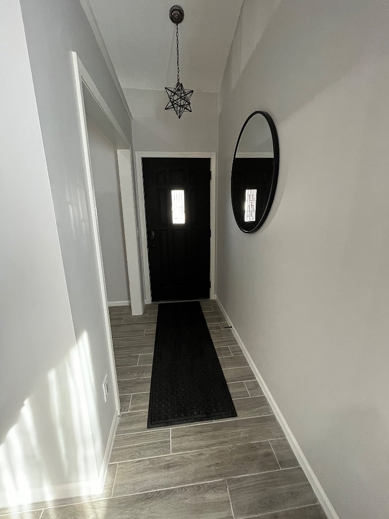 Front door with privacy glass which opens up to a small breezeway.