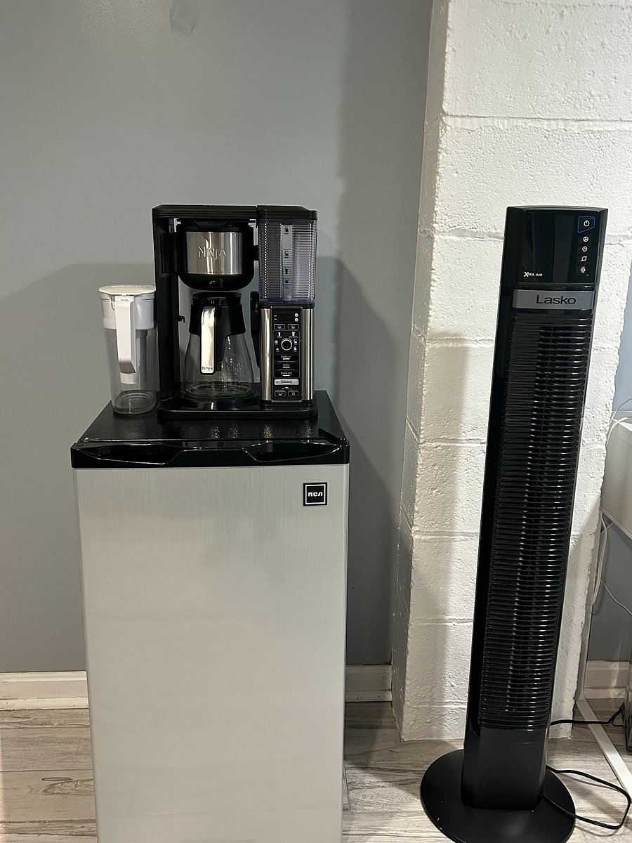 Coffee maker, Britta filter, mini fridge, and fan.