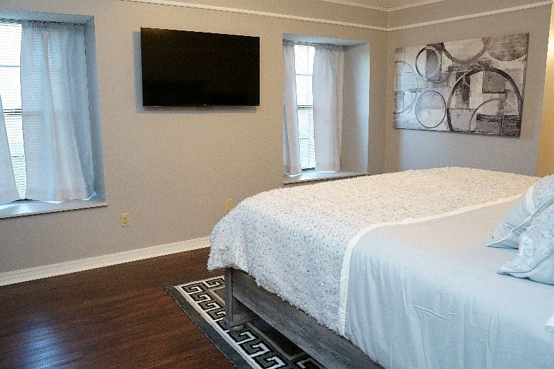 Master Suite With Mounted 55" Smart TV