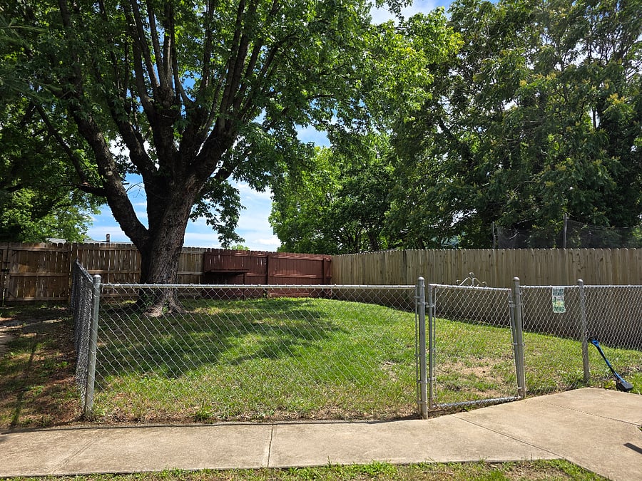 Shared fenced area for the four legged family members.