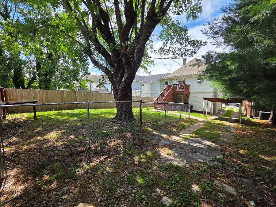 Shared fenced area for the four legged family members.